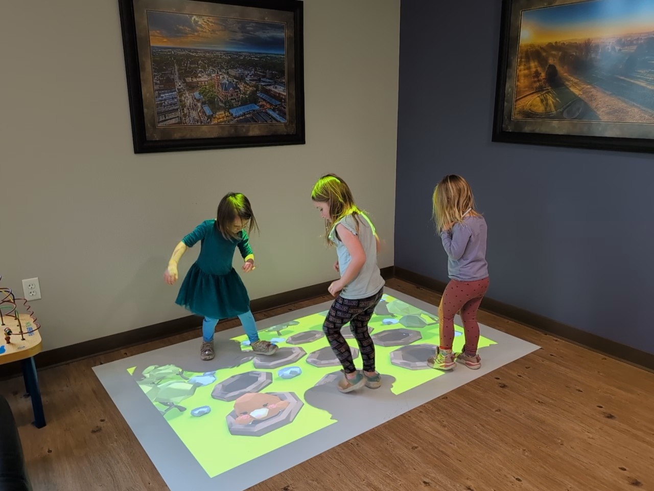 children playing with interactive floor games